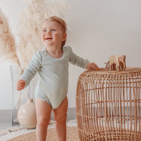 US stockist of India + Grace The Label's gender neutral, dusty sage long sleeved ribbed cotton bodysuit.  Features crotch snap.