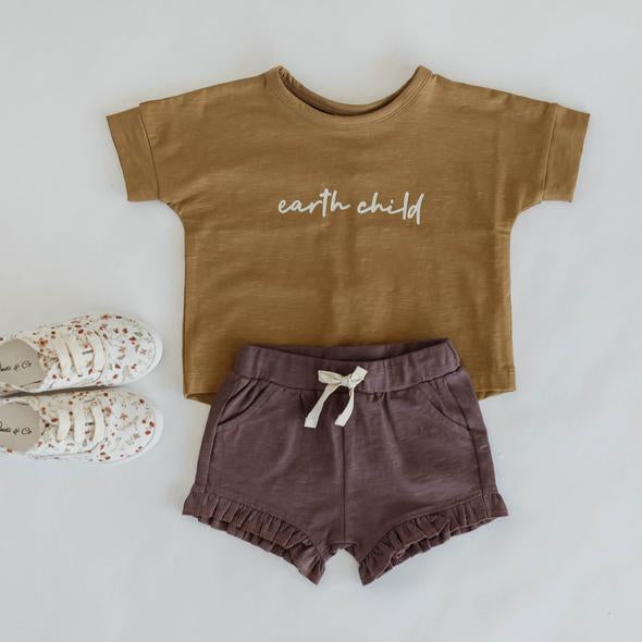 US stockist of Buck & Baa's organic cotton "Earth Child" short sleeve t-shirt.  Boxy fit, with white "Earth Child" printed across the chest.  Ochre color.