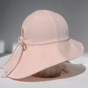 US stockist of Fini the Label's floppy swim hat in pale pink. Features elongated back for added sun protection, chin strap and adjustable bow around crown for better fit. Brim is medium stiffness and can be flipped up at front.  Made from nylon/spandex and is quick drying.
