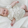 US stockist of Buck & Baa's organic cotton floral peplum top. Cream fabric with all over blue floral print.