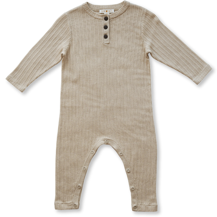 US stockist of Grown Clothing's gender neutral, organic cotton ribbed button jumpsuit in Natural.
