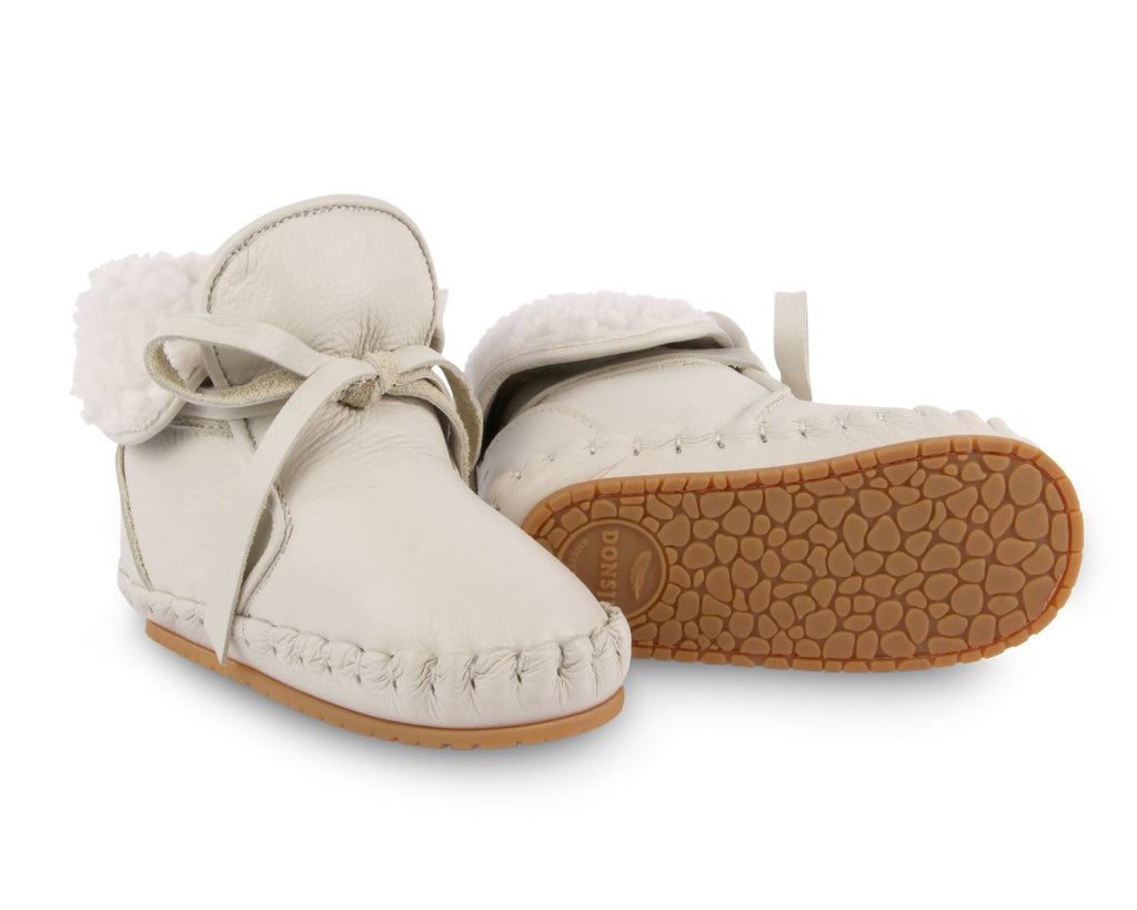 US stockist of Donsje's gender neutral Jaya baby shoe in off white leather.  Handmade, moccassin style shoe, lined and with laces.