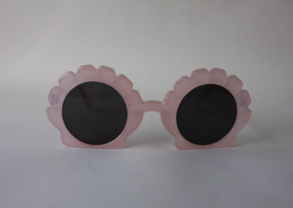 US stockist of Elle Porte's Shelly sunglasses in pink.  Shell shaped frames with dark UV 400 lenses.