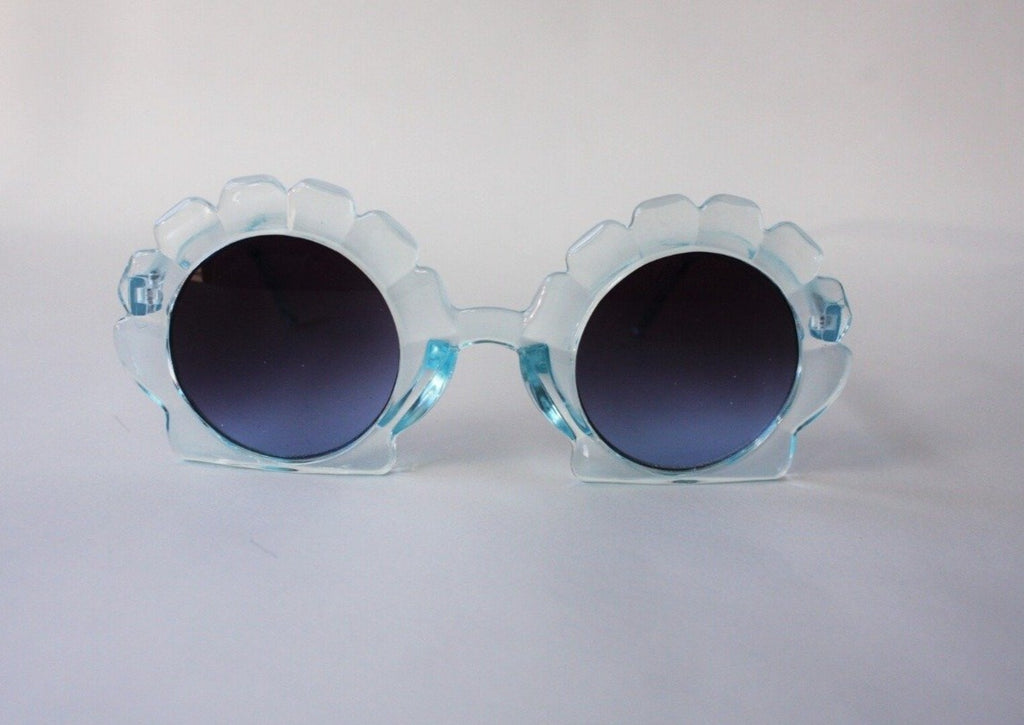 US stockist of Elle Porte's Shelly sunglasses in blue.  Shell shaped frames with dark UV 400 lenses.