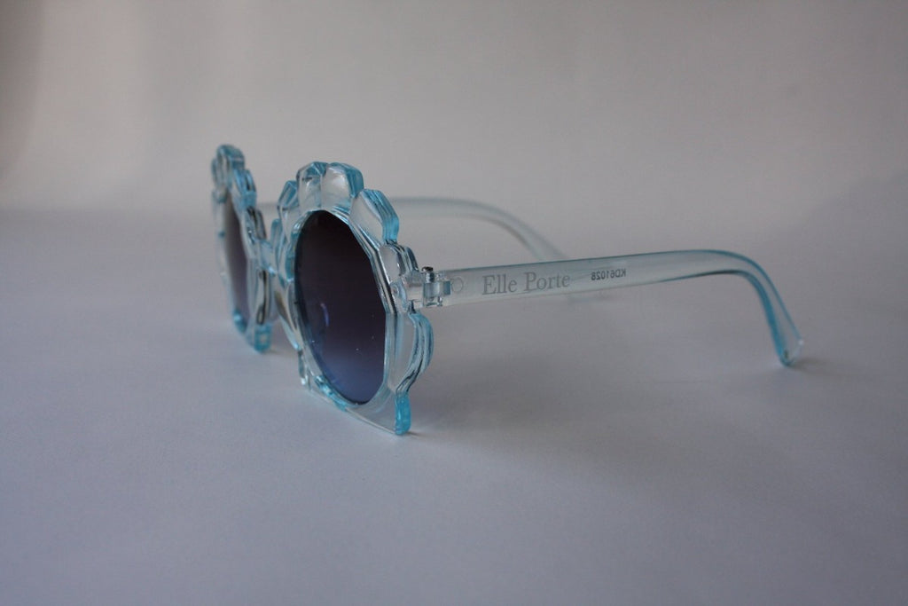 US stockist of Elle Porte's Shelly sunglasses in blue.  Shell shaped frames with dark UV 400 lenses.