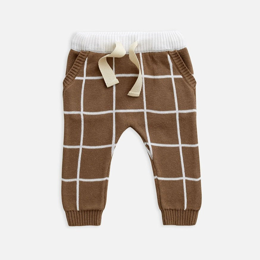 US stockist of Miann & Co's baby knit pants in cafe au lait grid. Made from 100% cotton with elastic waist, functional drawstring and pockets.