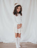 US stockist of Karibou Kids' whimsy love ruffle sleeve, cotton waffle top in snow white.  Features keyhole tie front of neck.