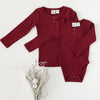US stockist of Karibou Kids gender neutral, Storybook Red Willow long sleeve henley bodysuit in ribbed cotton blend.