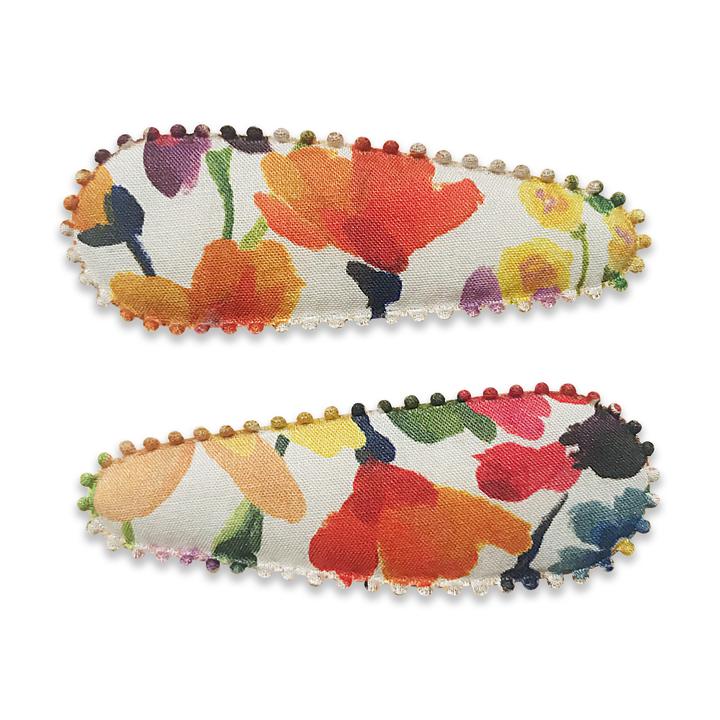 US stockist of Josie Joan's Lucy fabric hair clips.  Set of two fabric hair clips made from pale coloured fabric with beautiful multicolored wildflowers.  Has scalloped edging.