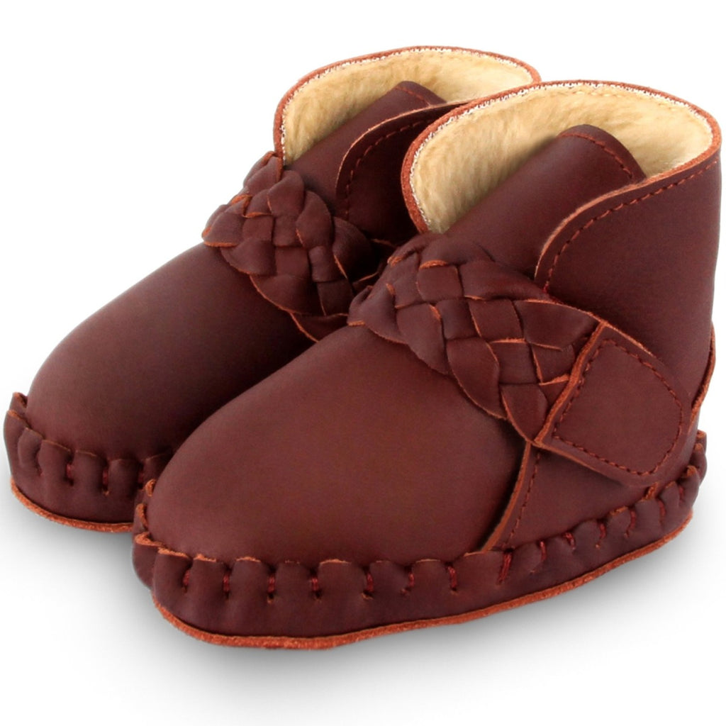 US stockist of Donsje's Burgundy classic leather  baby shoes with Mace faux fur lining.  Velcro braided fastening - soft sole under 12mths.