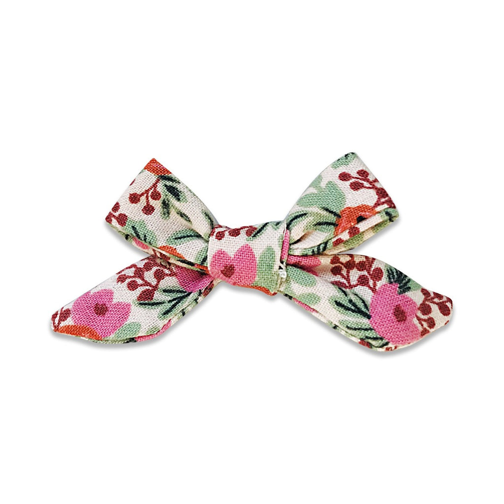 US stockist of Josie Joan's Marni petite bow hair clip.  Cream colored fabric with pink and orange flowers and contrasting green foilage.  