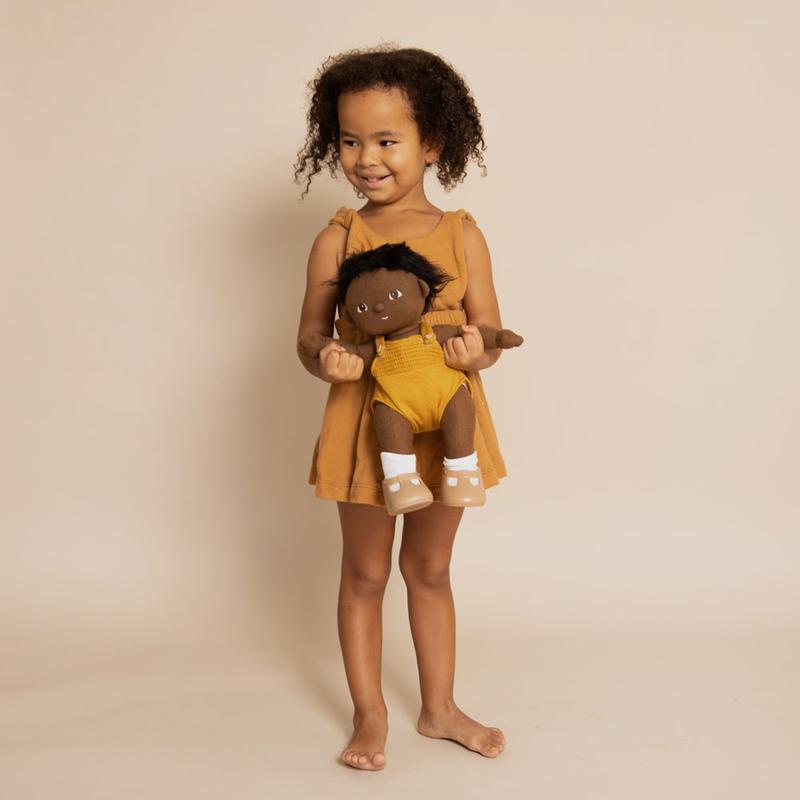 US stockist of gender neutral, black haired, dark eyed Olli Ella Tiny dinkum doll.  