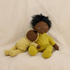 US stockist of Olli Ella's gender neutral, Mini Dozy Dinkum.  Features tuft of black hair with non removable hooded yellow onesie.