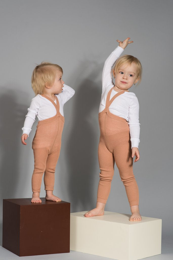 US stockist of Silly Silas gender neutral retro ribbed footed tights in light brown.  Made from 100% cotton and featuring braces.