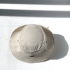 US stockist of Fini the Label's gender neutral, sailor swim hat in cream. Features elongated back for added sun protection, wide brim and chin strap. Brim is medium stiffness and can be flipped up at front. Sides can be worn buttoned up for that sailor look.  Made from nylon/spandex and is quick drying.