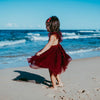 US stockist of Karibou Kid's Scarlett Tutu Dress.  Made from a soft cotton blend with midi length tulle skirt.  Features open back with a big bow.