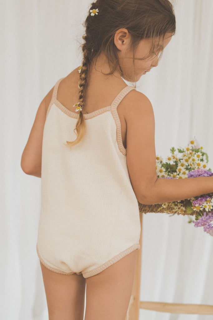 US stockist of Illoura the Label's Apricot Scout Onesie.  Made from 100% cotton in a neutral color with apricot trim.