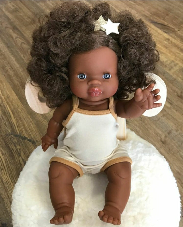 US stockist of Minikane's "Charlie" girl doll.  Measures 13" in height and has moveable limbs.  Anatomically correct and features curly brown hair, brown skin and blue eyes.