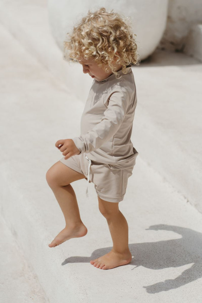 US stockist of Illoura the Label's Sol Rashie in Pale Khaki.  Made from UPF 50 Econyl fabric.