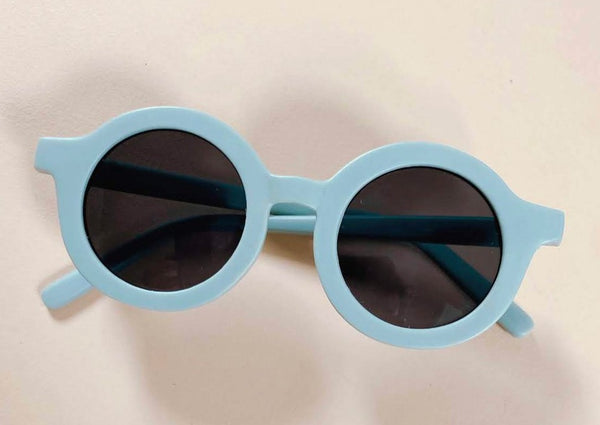 US stockist of Grech & Co's gender neutral sustainable sunglasses.  Made from recycled plastic, with round grey lens with UV 400 protection in a light blue color.
