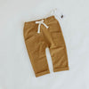 US stockist of Buck & Baa's gender neutral organic cotton tumeric pocket pants.  Features elastic waist with functional drawstring and two front pockets.
