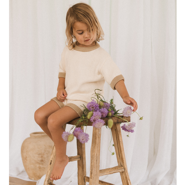 US stockist of Illoura the Label's gender neutral, Olive Jolie Knit Romper.  Made from 100% cotton in a neutral color with contrasting olive rib trimming.
