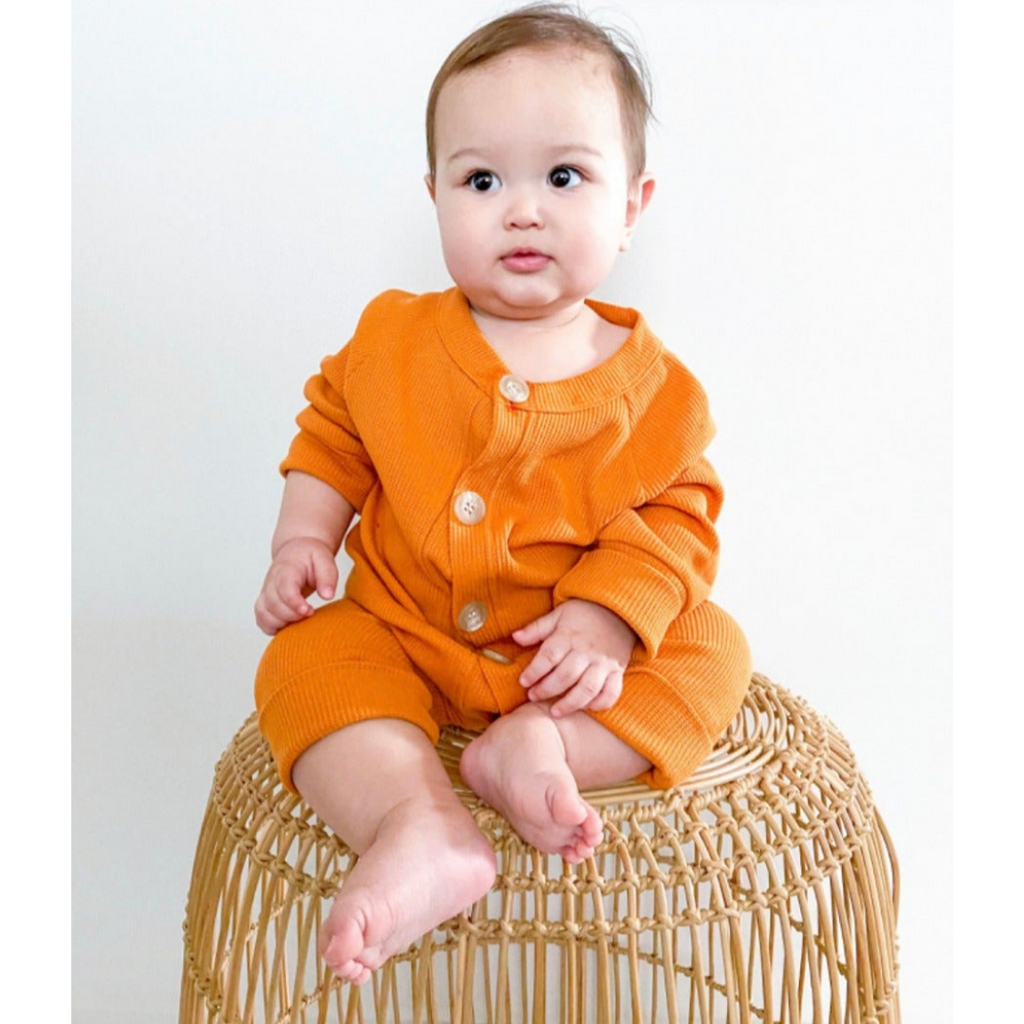 US stockist of Fable & Ford's gender neutral waffle button up romper in bronze.  Made from 100% cotton with buttons down the front and thick cuffs.