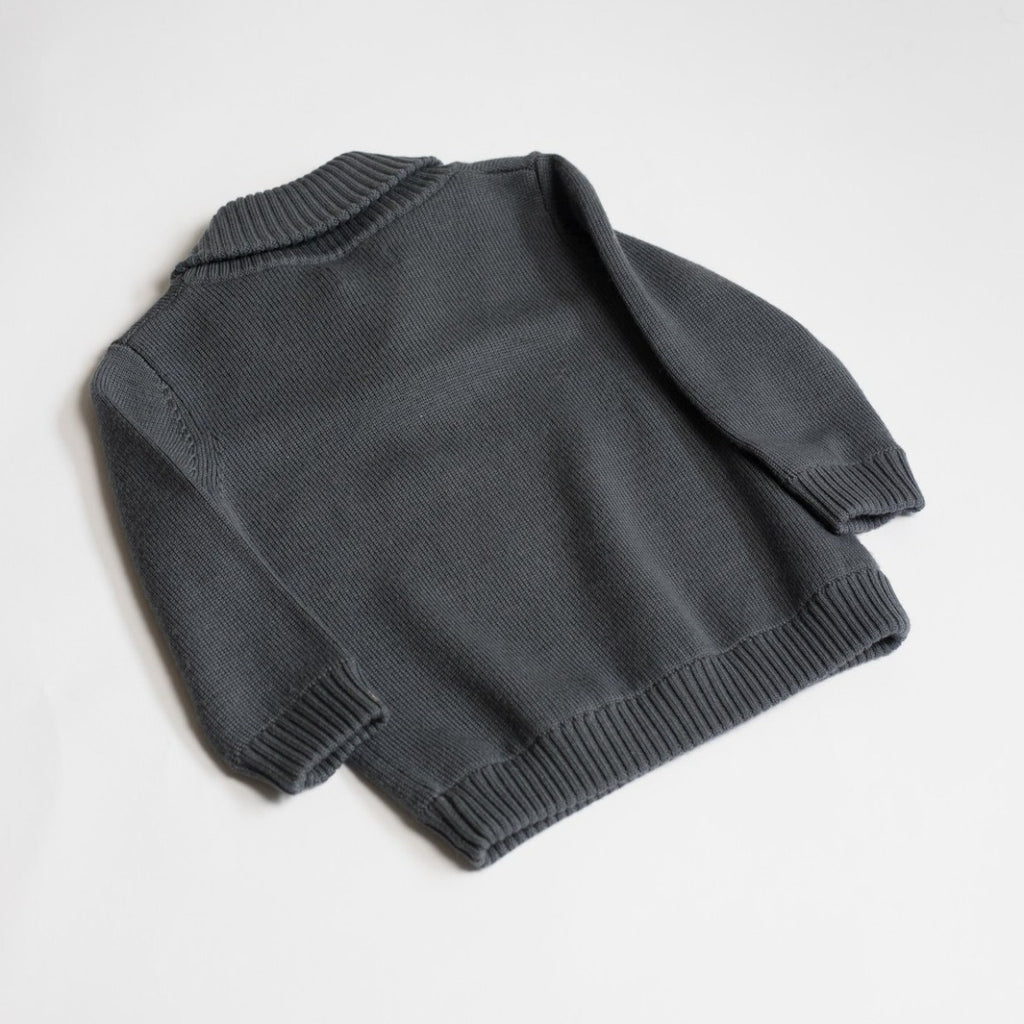 US stockist of Five O' Six's gender neutral "Charcoal" shawl neck sweater made from 100% merino wool.