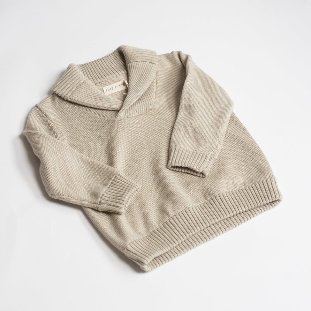 US stockist of Five O' Six's gender neutral "Bone" shawl neck sweater made from 100% merino wool.