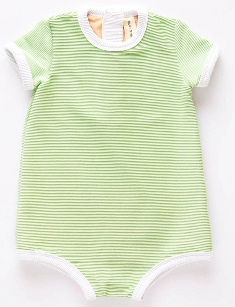 The US stockist of Zulu & Zephyr Mini Rib Onesie in Marine.  A loose fit gender neutral style made from sustainable ECONYL UPF 50+ fabric.  Short sleeved with contrasing back zipper and binds.  Fully lined.