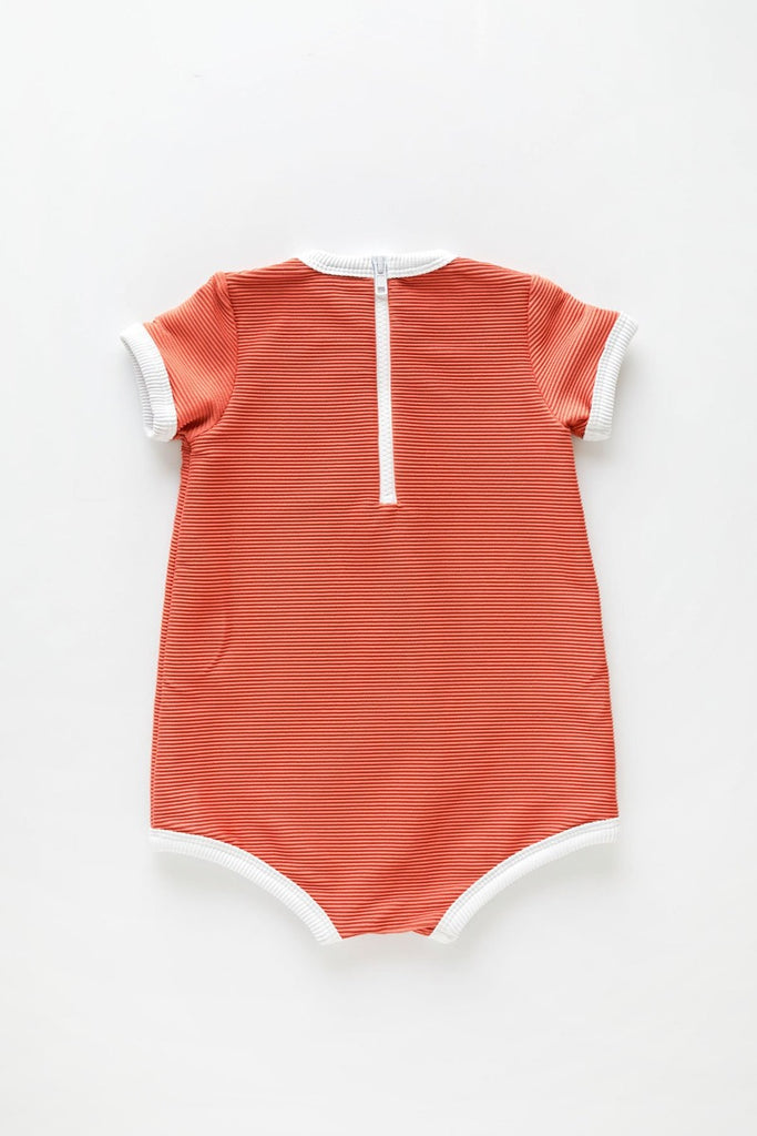 The US stockist of Zulu & Zephyr Mini Rib Onesie in Plum.  A loose fit gender neutral style made from sustainable ECONYL UPF 50+ fabric.  Short sleeved with contrasing back zipper and binds.  Fully lined.
