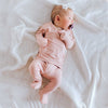 Stockist of Bonsie's rayon blend Peony pink footie.  Top section has velcro wrap body which can be undone for skin to skin contact.  Elastic waist that can be pulled down for easy diaper changes. 