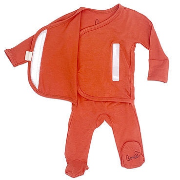 Stockist of Bonsie's rayon blend sunset red footie.  Top section has velcro wrap body which can be undone for skin to skin contact.  Elastic waist that can be pulled down for easy diaper changes. 