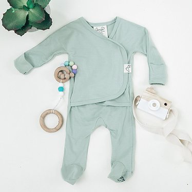 Stockist of Bonsie's rayon blend avocado green footie.  Top section has velcro wrap body which can be undone for skin to skin contact.  Elastic waist that can be pulled down for easy diaper changes. 