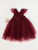 US stockist of Karibou Kid's Scarlett Tutu Dress.  Made from a soft cotton blend with midi length tulle skirt.  Features open back with a big bow.