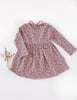 US stockist of Karibou Kid's Long Sleeve Cotton Puff pocket dress in dusty rose. Featues two front pockets and ties at back of neck.
