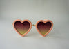 US stockist of Elle Porte's Heart shaped sunglasses in peach.