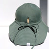 US stockist of Fini the Label's gender neutral, floppy swim hat in Ivy Green. Features elongated back for added sun protection, chin strap and adjustable bow around crown for better fit. Brim is medium stiffness and can be flipped up at front.  Made from nylon/spandex and is quick drying.