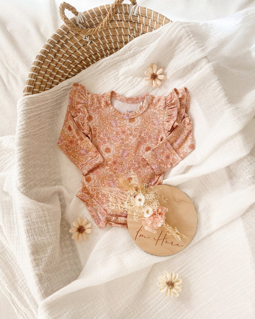 US stockist of India & Grace's Organic long sleeve ruffle bodysuit in Bloom Floral.