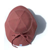 US stockist of Fini the Label's gender neutral, floppy swim hat in marsala. Features elongated back for added sun protection, chin strap and adjustable bow around crown for better fit. Brim is medium stiffness and can be flipped up at front.  Made from nylon/spandex and is quick drying.