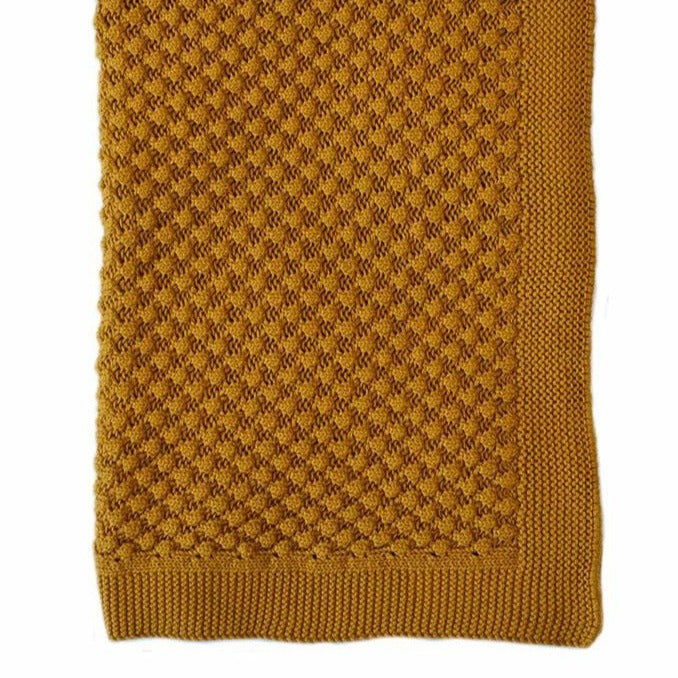 US stockist of Indus Design's Mustard cotton Mini Popcorn blanket.