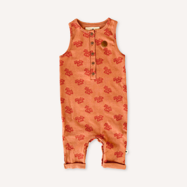 US stockist of My Brother John's Ziggy Stomper. Tank romper in a warm orange color with cozy fleece lining and rolled leg cuffs.  Great worn layered.