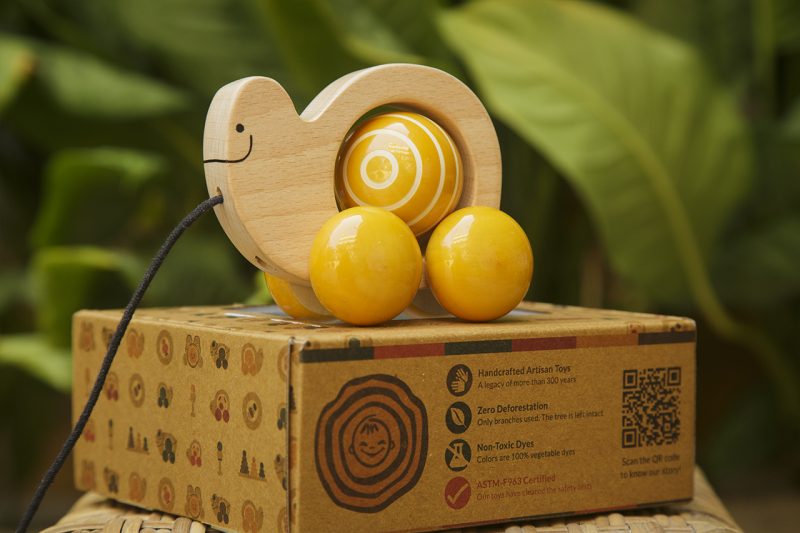 US stockist of Fair & Green's handmade wooden, baby spinning snail toy.