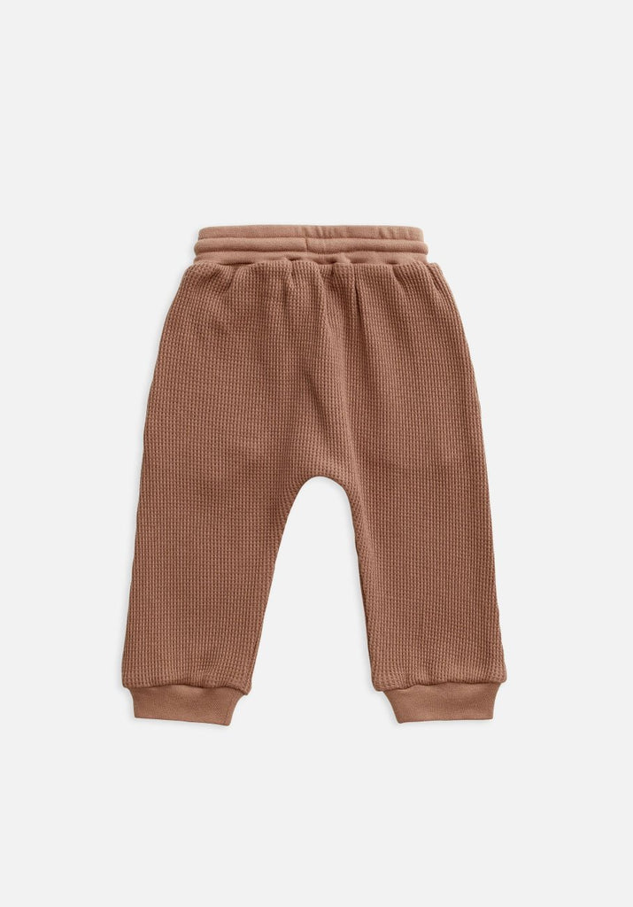 US stockist of Miann & Co's butterscotch baby waffle pants.  Made from 100% waffle cotton with slight drop crotch and functional drawstring with elastic waist.